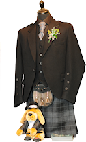 Designer jacket and waistcoat with black buttons. With grey Highlander Kilt, black shirt and charcoal cravat